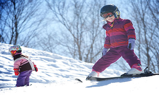 young-skiers-top-of-hill.jpg